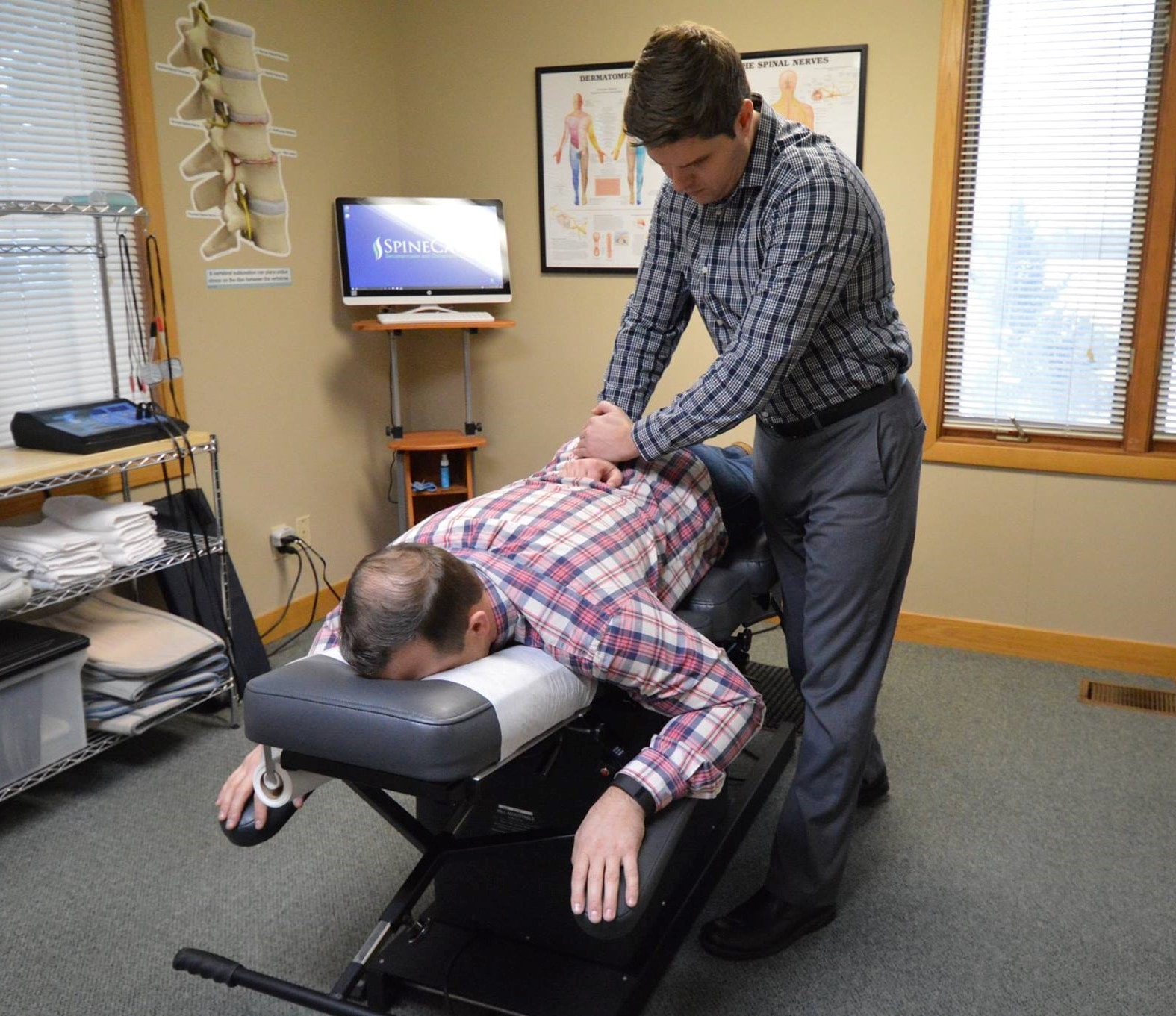 Dr. Rowe giving chiropractic adjustment